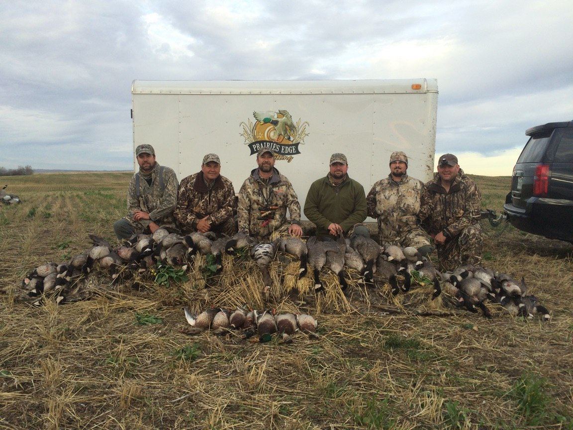 Saskatchewan waterfowl group photo with the Prairies Edge Outfitting trailer and a mixed-bag harvest Saskatchewan waterfowl group photo with the Prairies Edge Outfitting trailer and a mixed-bag harvest